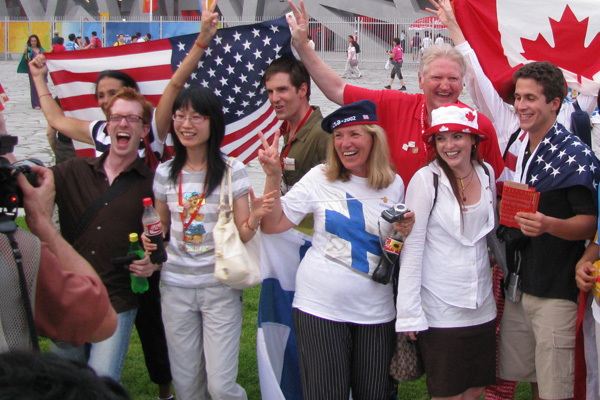 International sports fans celebrating together with national flags